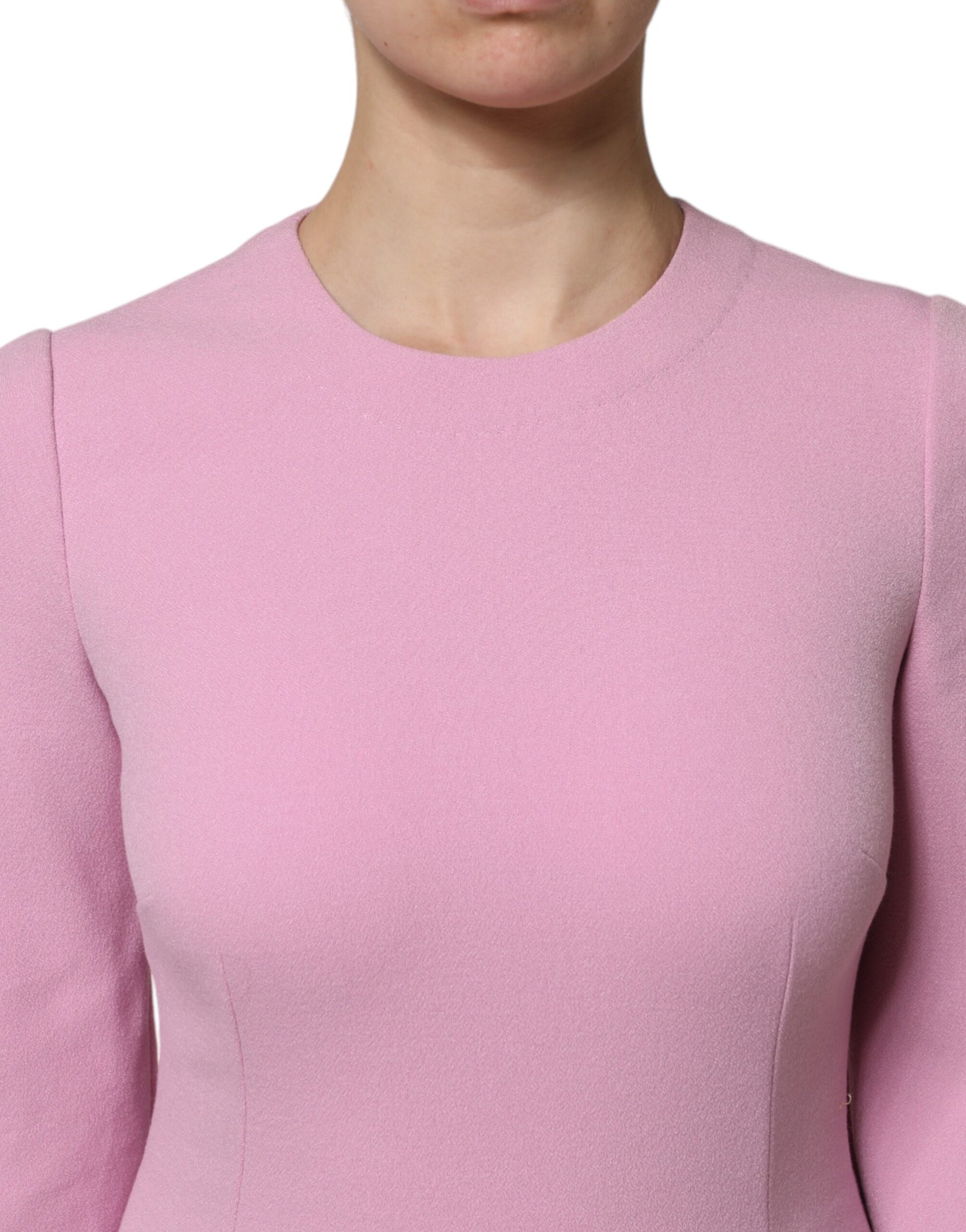 A pink polyester sheath dress with long sleeves, designed by Dolce & Gabbana