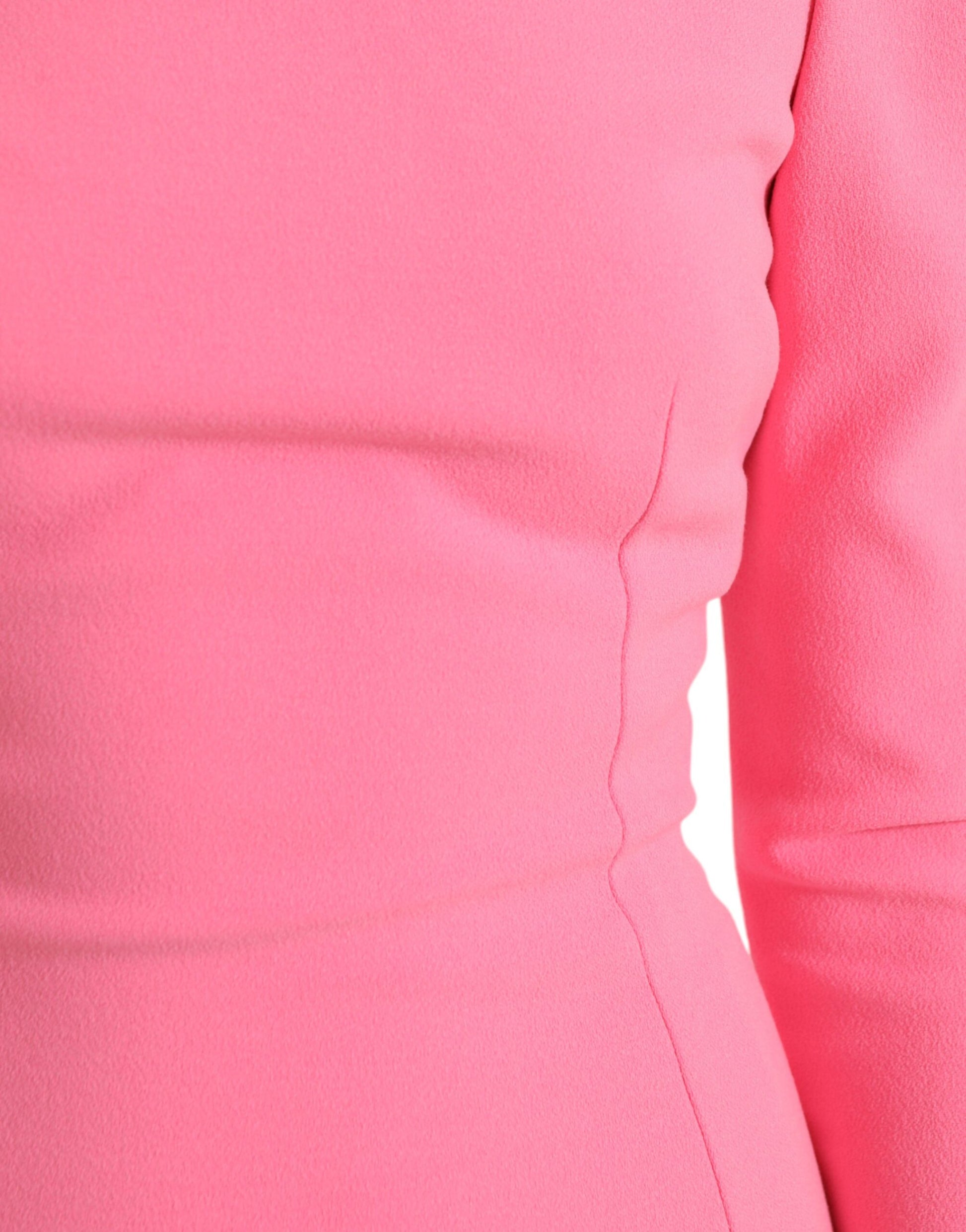 A pink midi dress with long sleeves, made of polyester. It is designed by Dolce & Gabbana and features a shea
