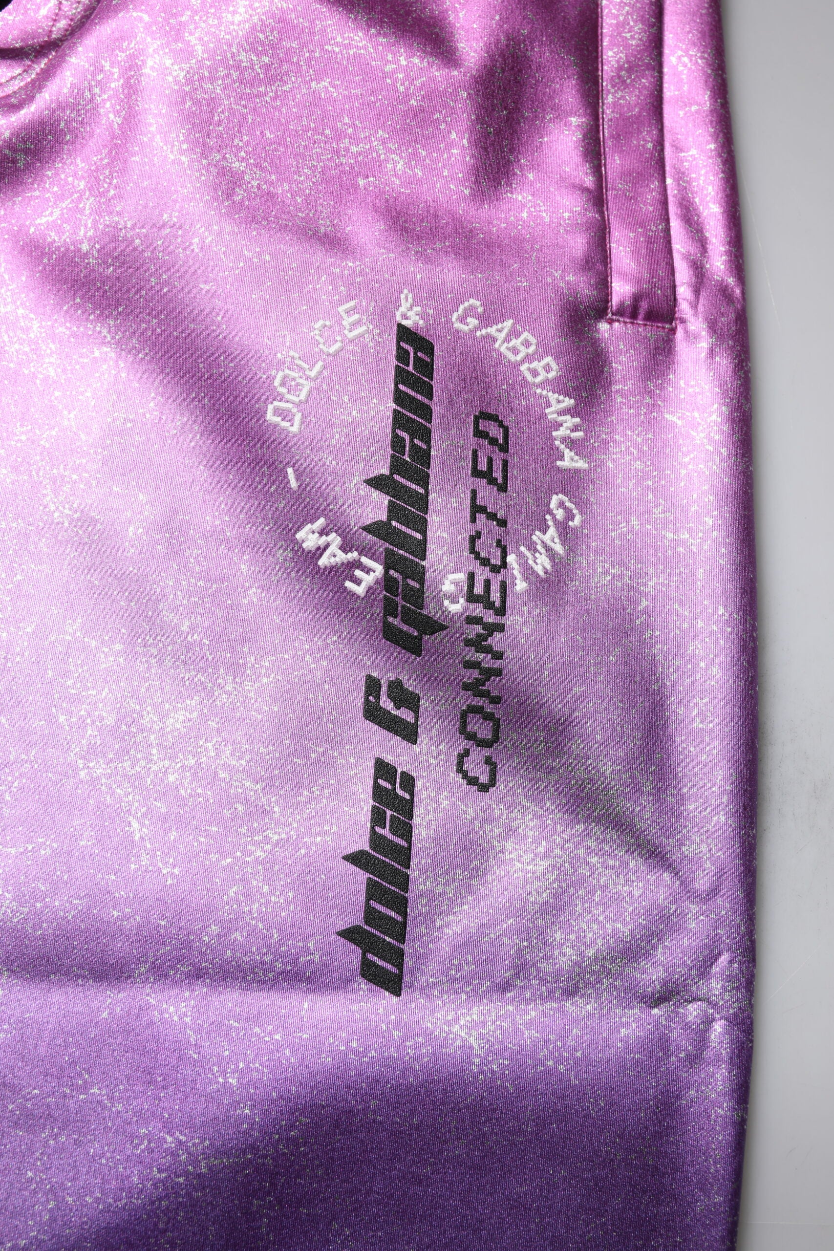 Purple satin fabric with embroidery on edge