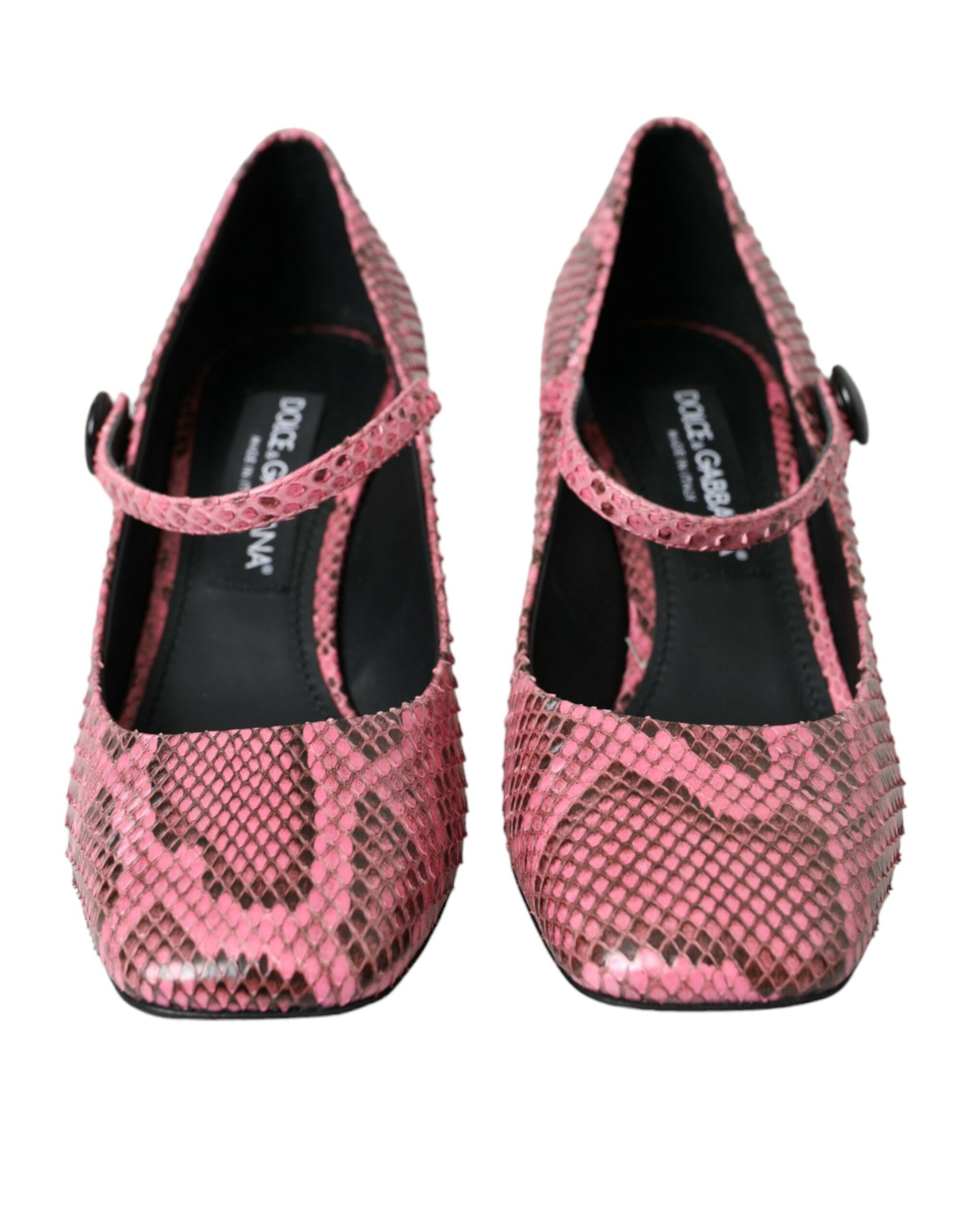 Pair of pink high heel shoes with embellishments and a bow on top