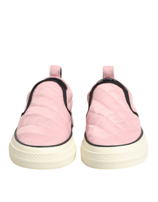 Pair of pink quilted nylon slip-on shoes with white soles