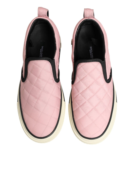Pair of pink quilted nylon slip-on shoes with black laces and soles