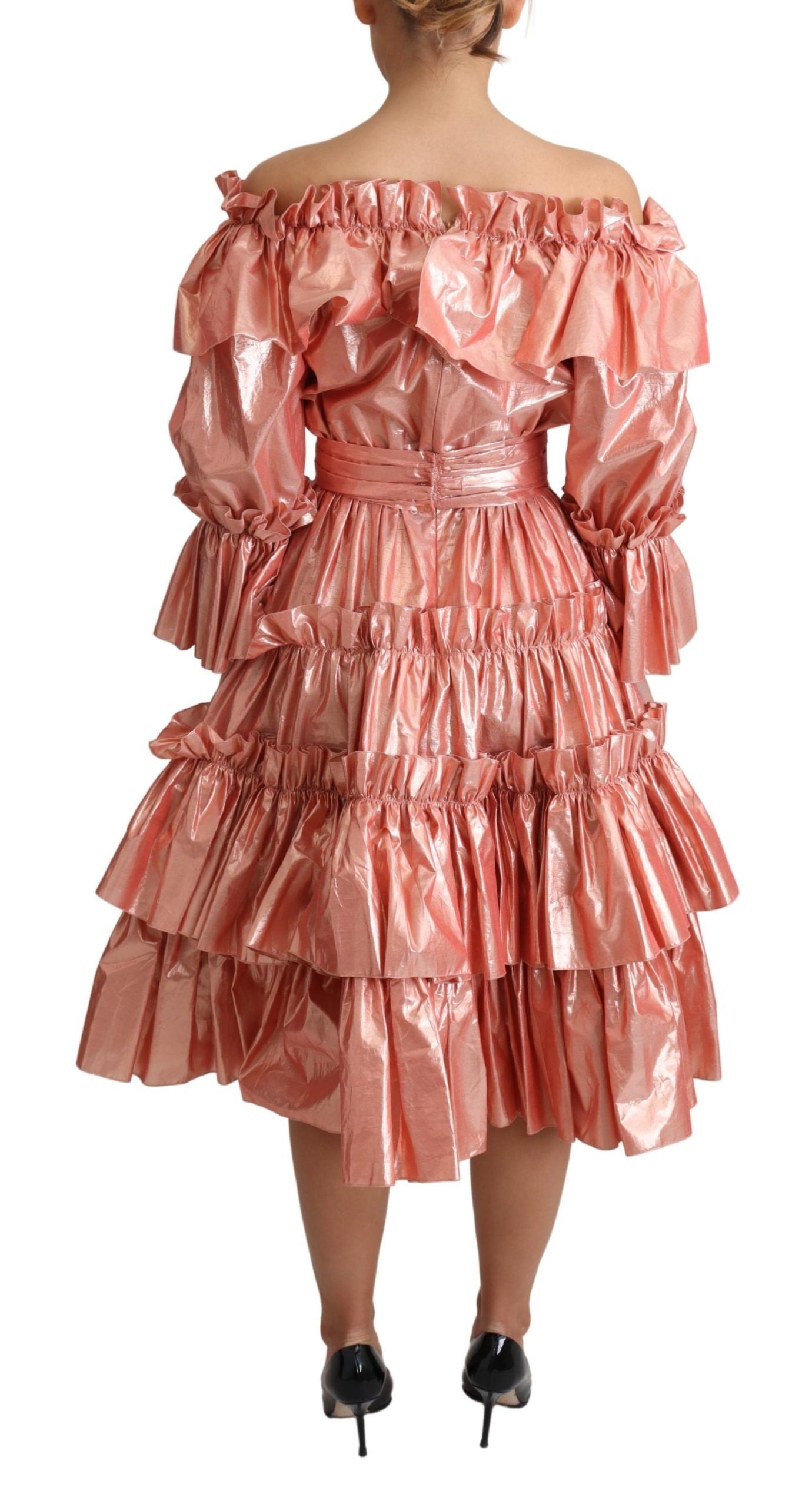 A pink ruffled dress with a silky and cotton blend fabric