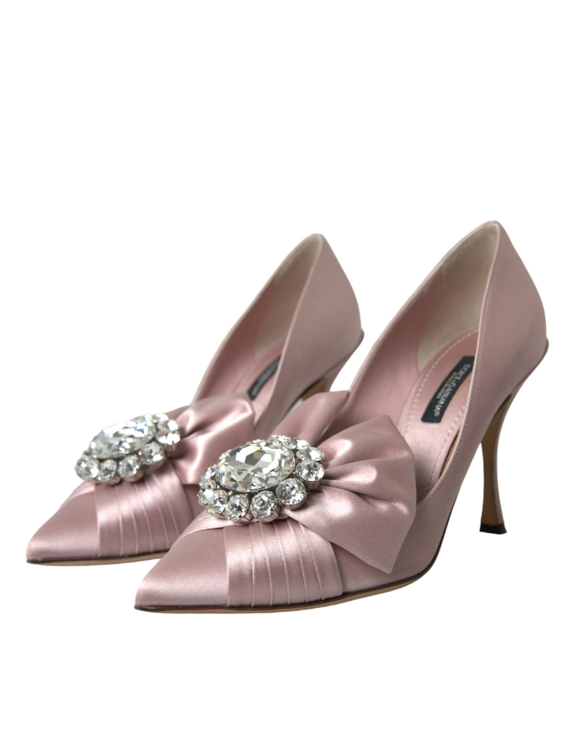 Pair of pink satin heels with rhinestone bow on top