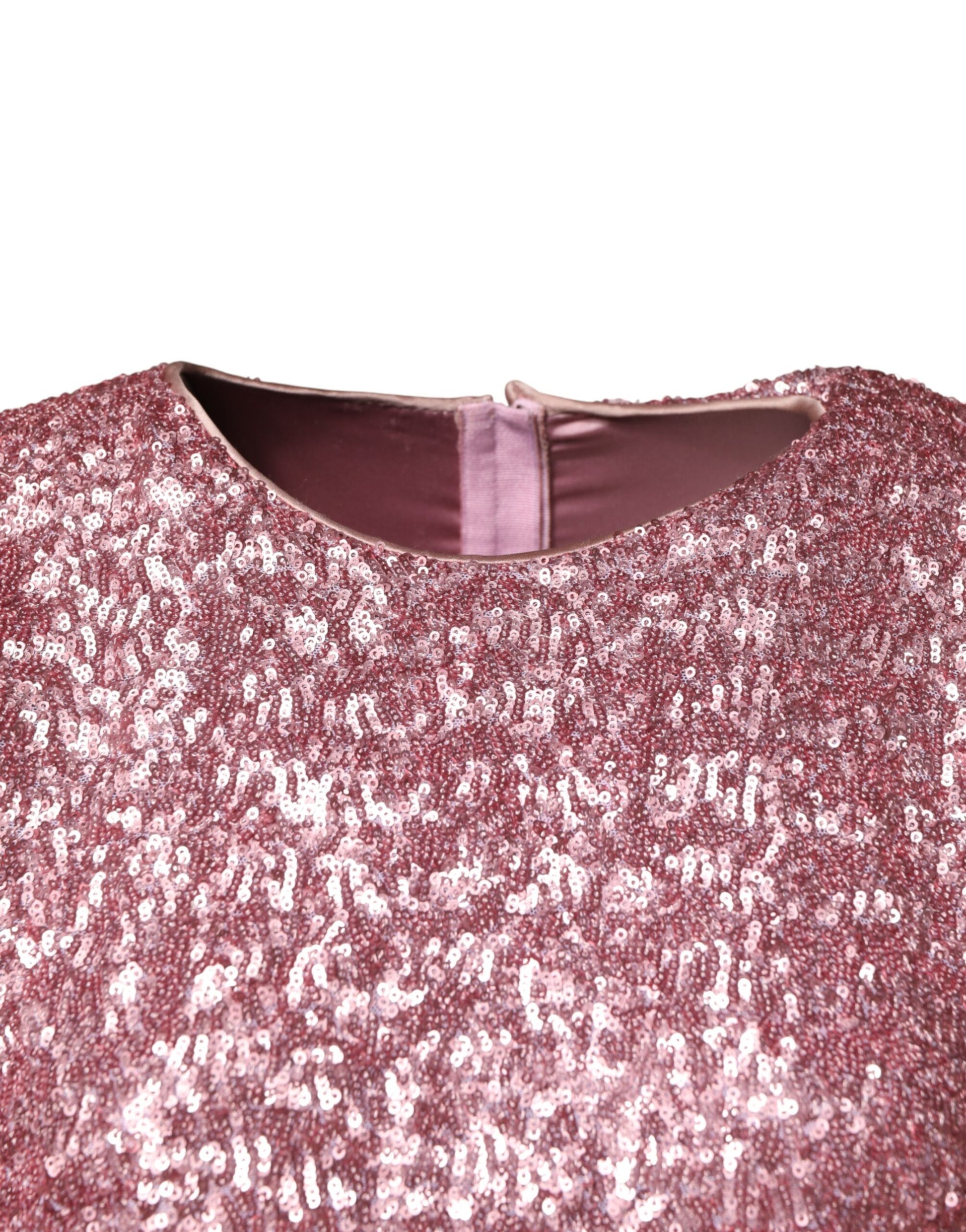 A pink sequined mermaid dress with a long gown design