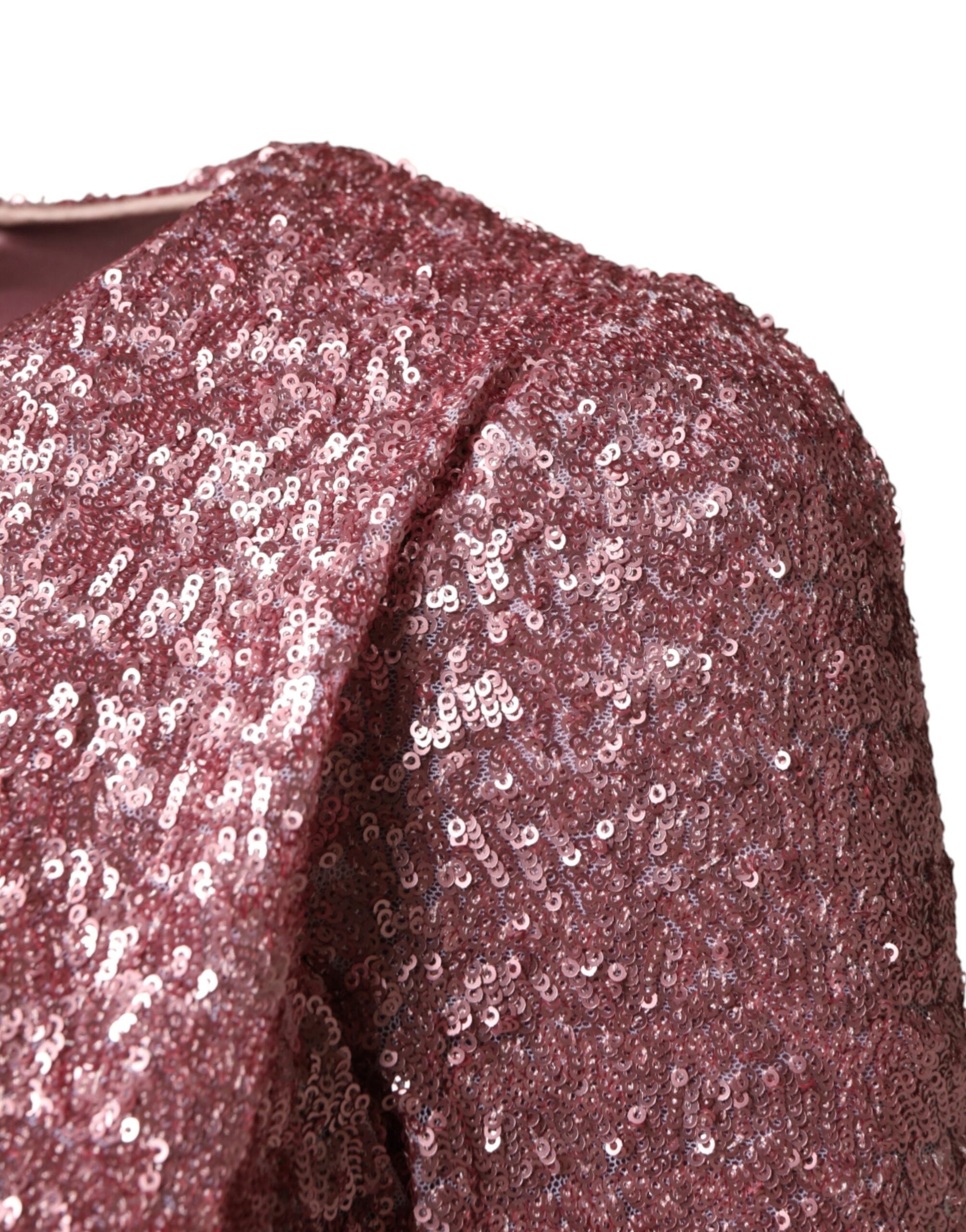A pink sequined mermaid dress with long sleeves