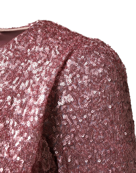 A pink sequined mermaid dress with long sleeves