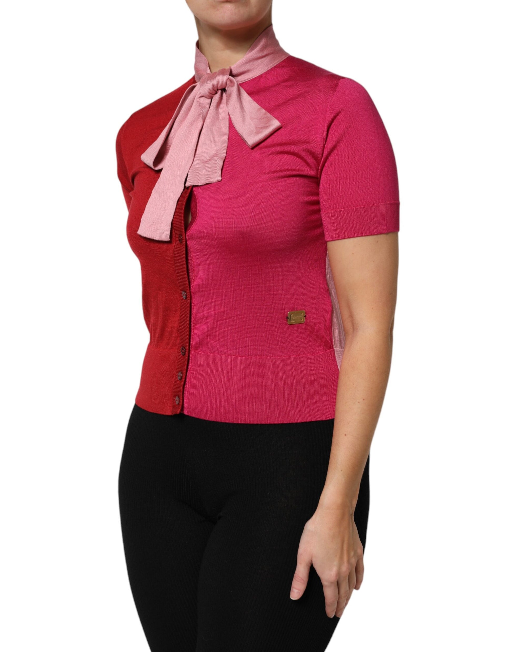 Woman wearing pink shirt with bow tie
