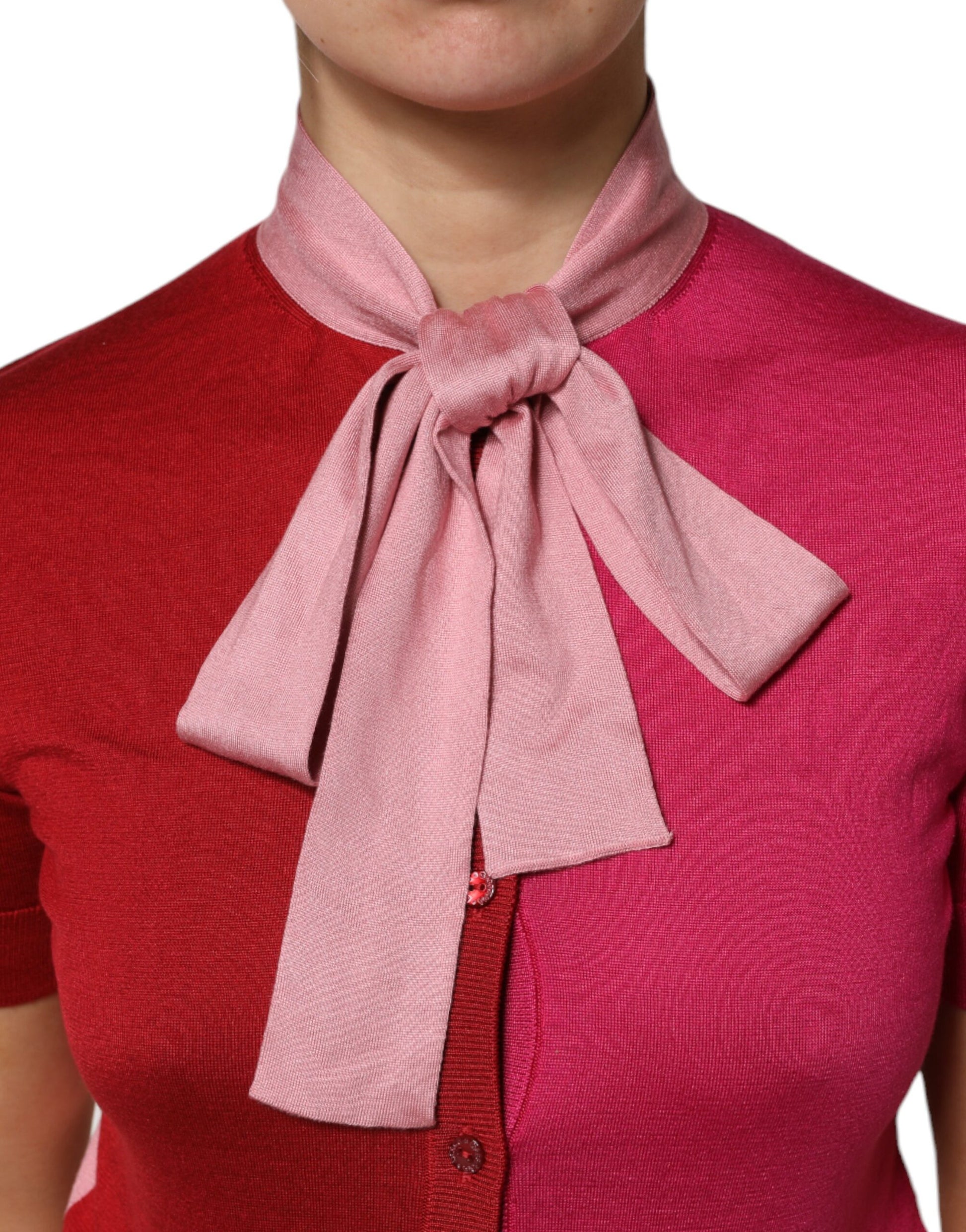 Woman wearing pink bow tie on red shirt