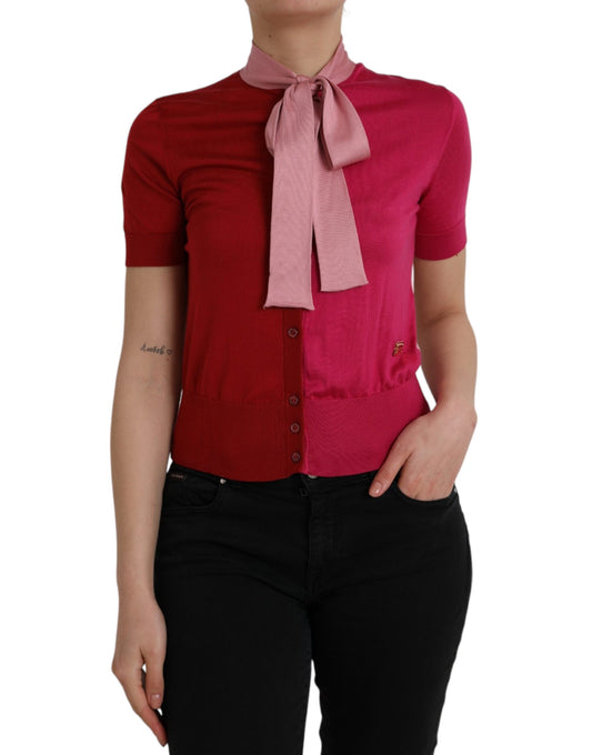 Woman wearing red shirt with pink bow tie