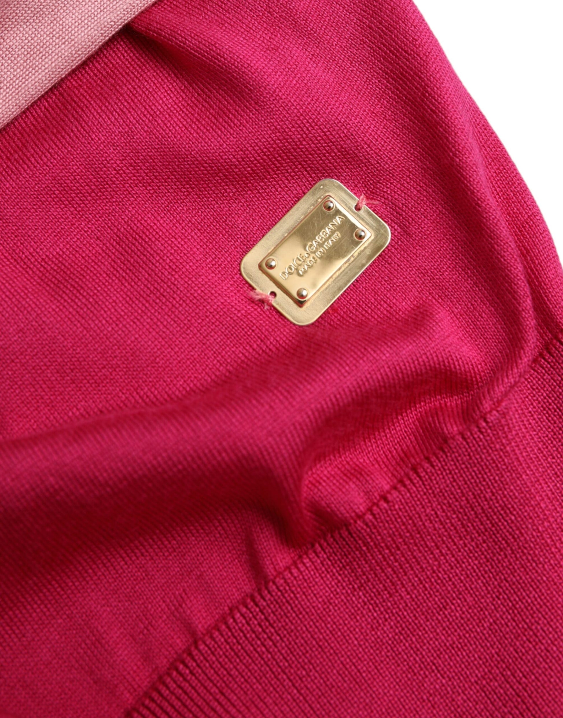 Red sweater with gold logo on left chest area