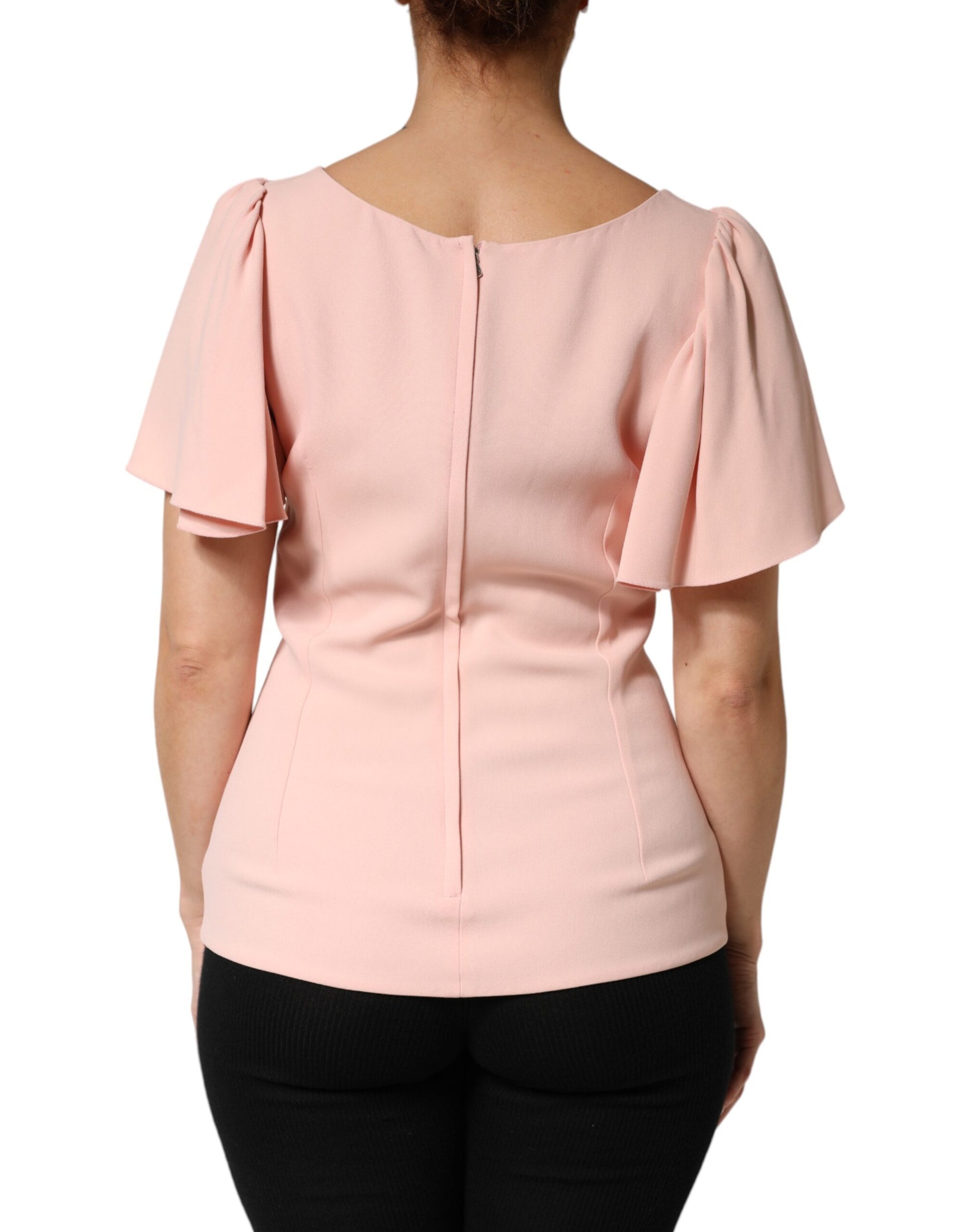 Pink sleeveless top with ruffled shoulders