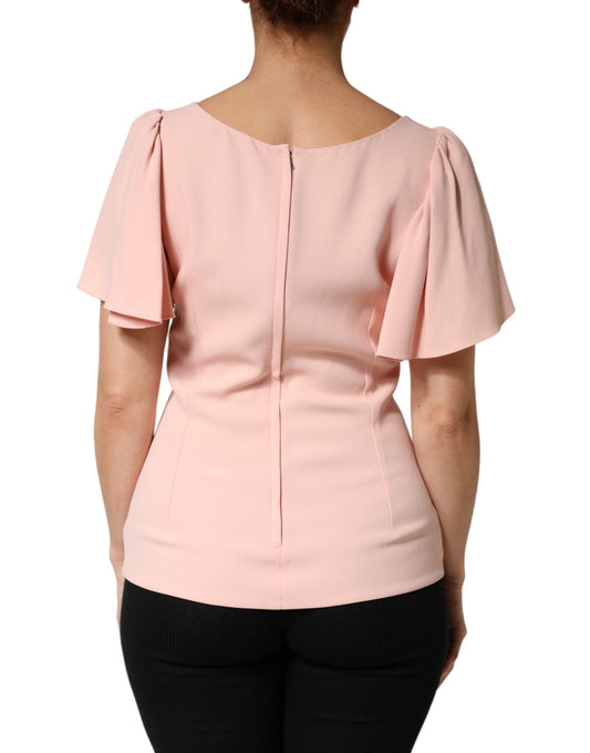 Pink sleeveless top with ruffled shoulders