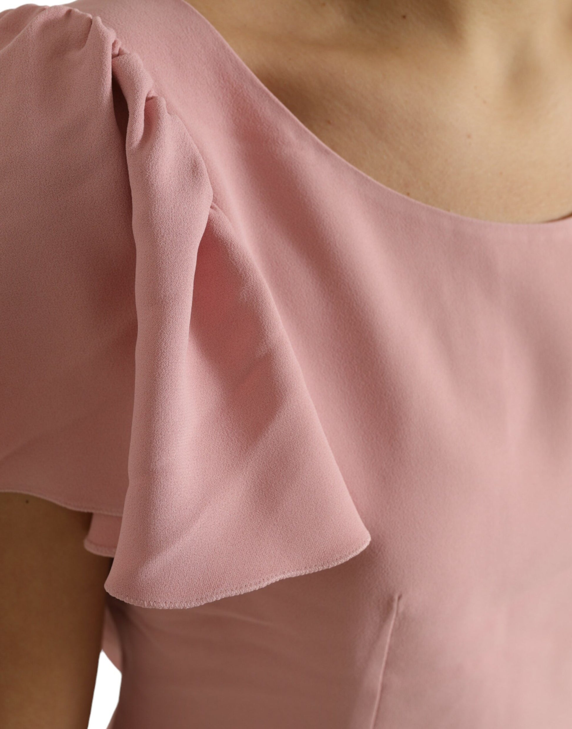 Pink sleeveless blouse with ruffled shoulder