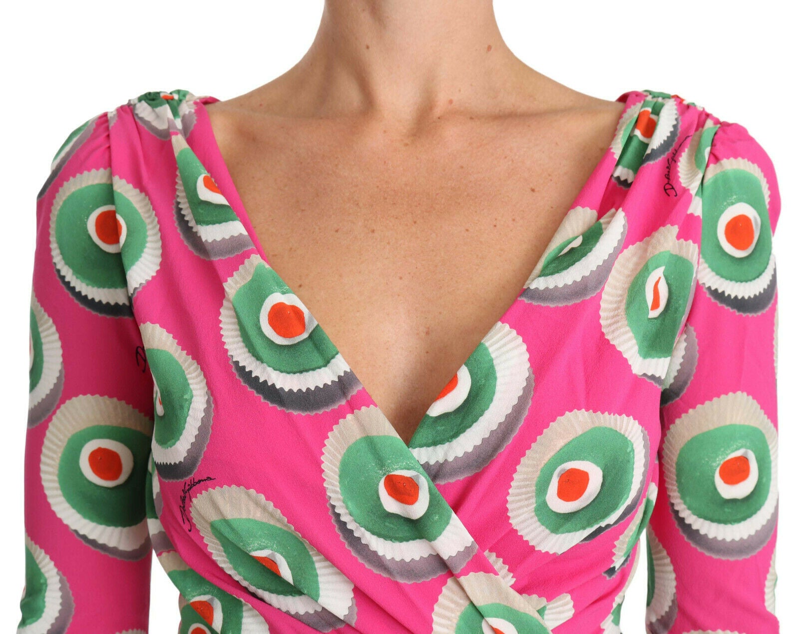 A pink silk dress with a cupcake pattern and stretchy material