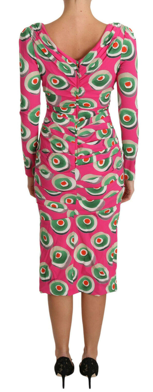 A pink silk dress with a cupcake print and stretchy material
