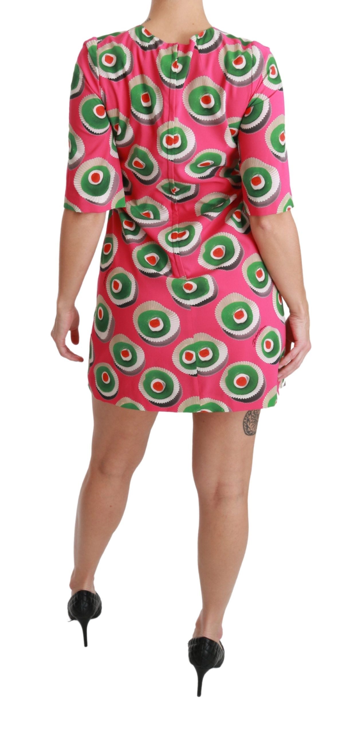 A pink silk dress with cupcake print and stretchy material