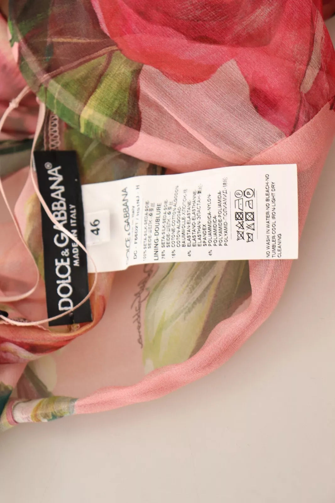 A pink silk floral print maxi dress with layered design, tagged by Dolce & Gabbana