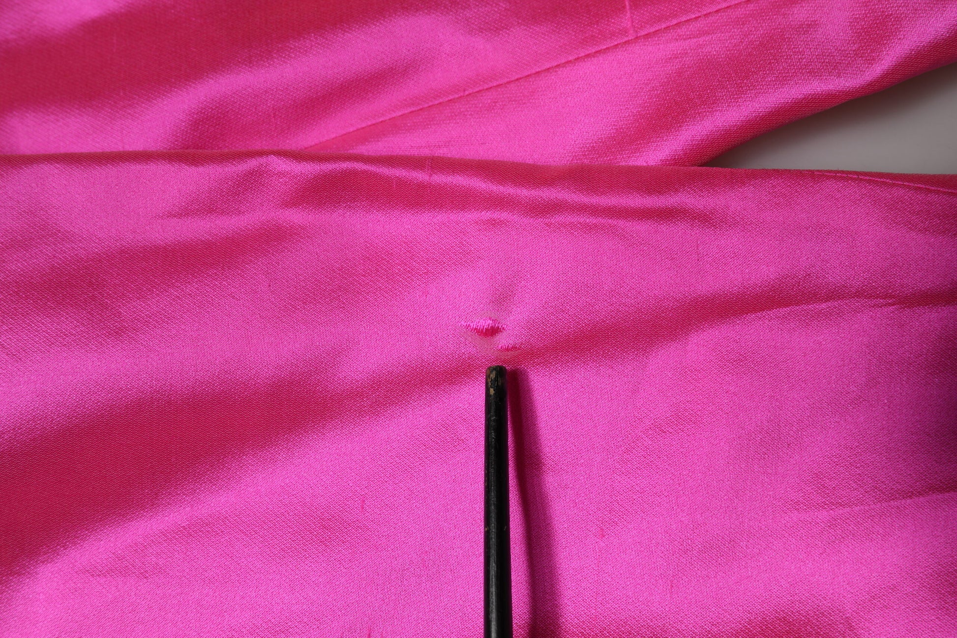 A pair of pink silk high waist trousers from Dolce & Gabbana