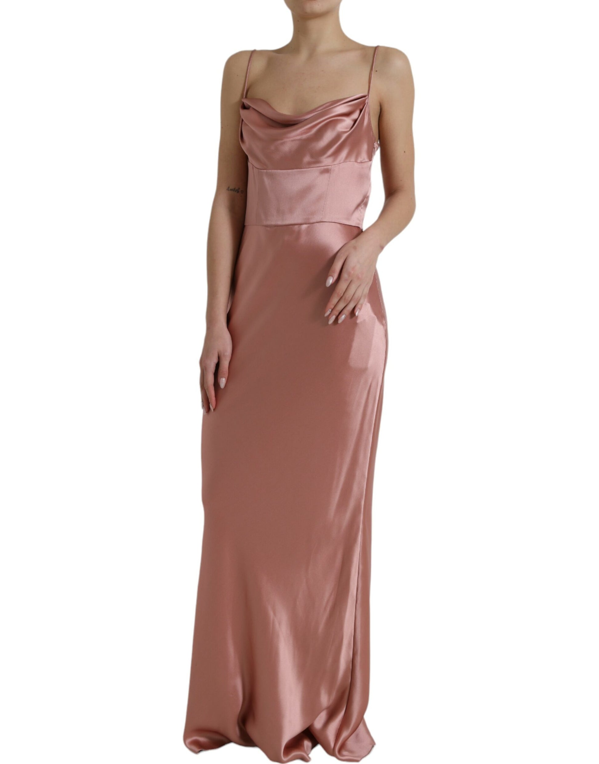 A long pink silk gown with spaghetti straps and a fitted bodice