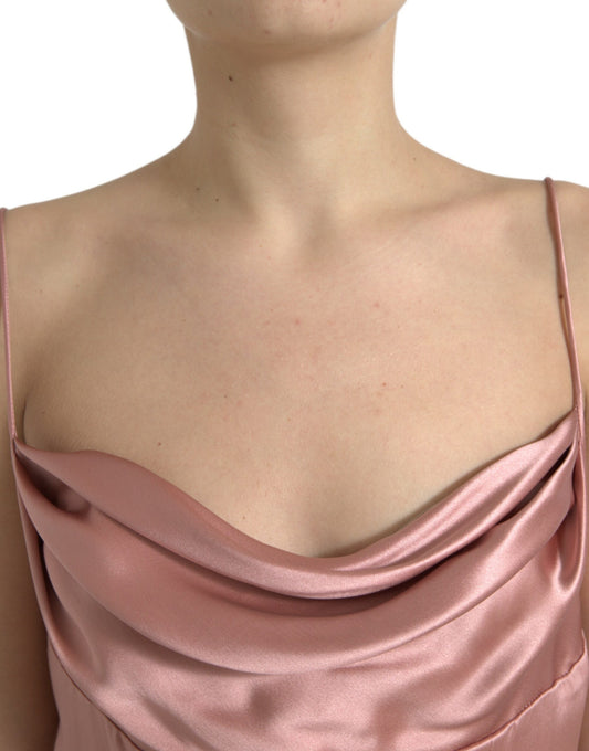 A pink silk spaghetti straps long gown dress with a ruched bodice