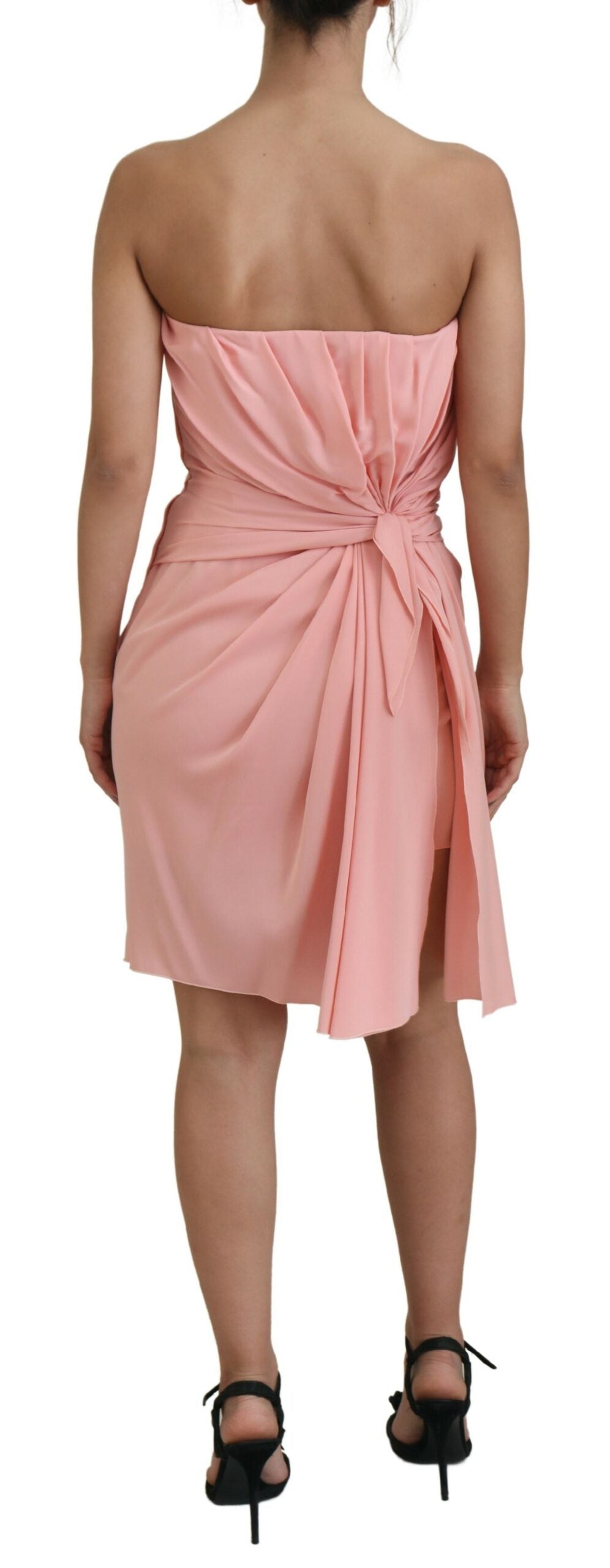 A pink strapless sheath dress with a ruched waist and skirt