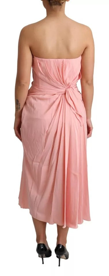 A pink strapless sheath dress with a stretchy silky fabric