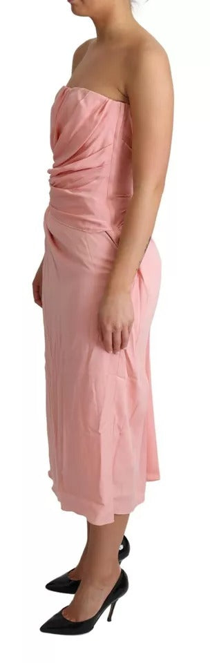 A pink silk strapless sheath midi dress with a stretchy fabric