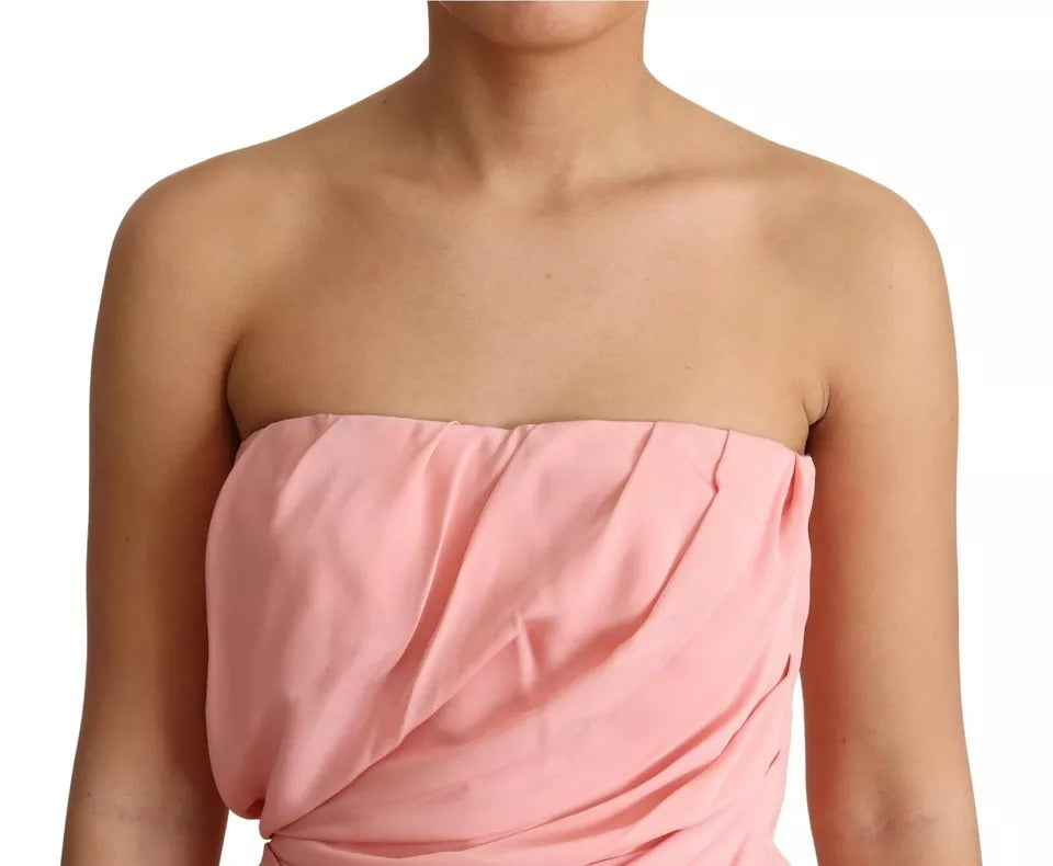 A pink strapless sheath dress with a stretchy silky fabric