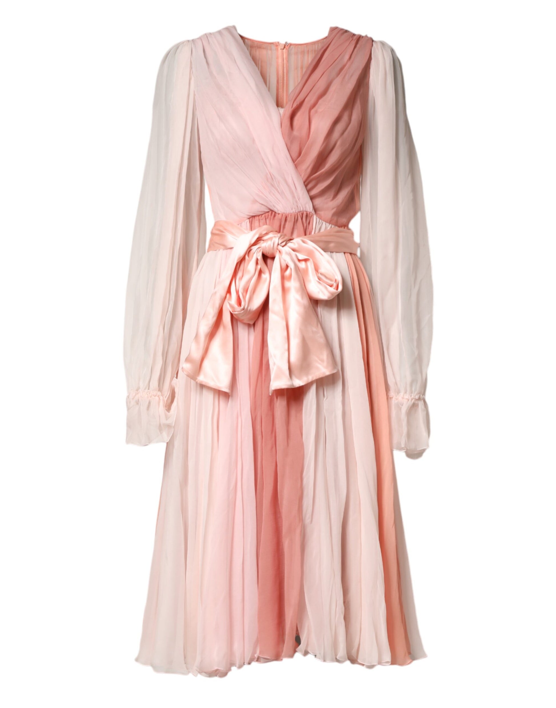 A long sleeve pink tulle dress with a V-neck and belted waist