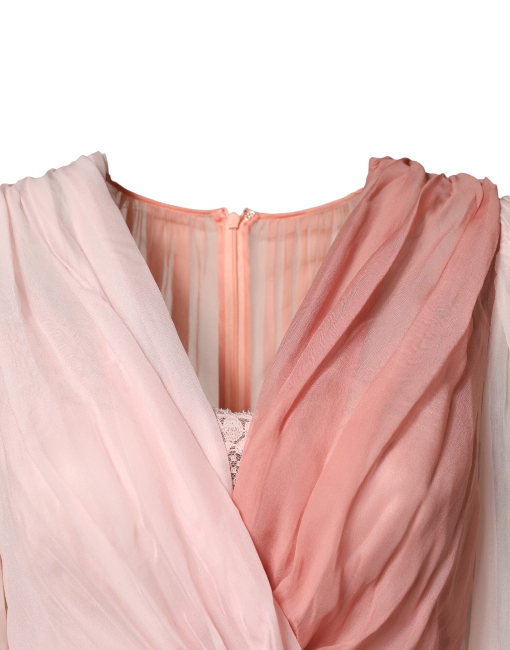 A pink silk tulle dress with long sleeves and a V-neck