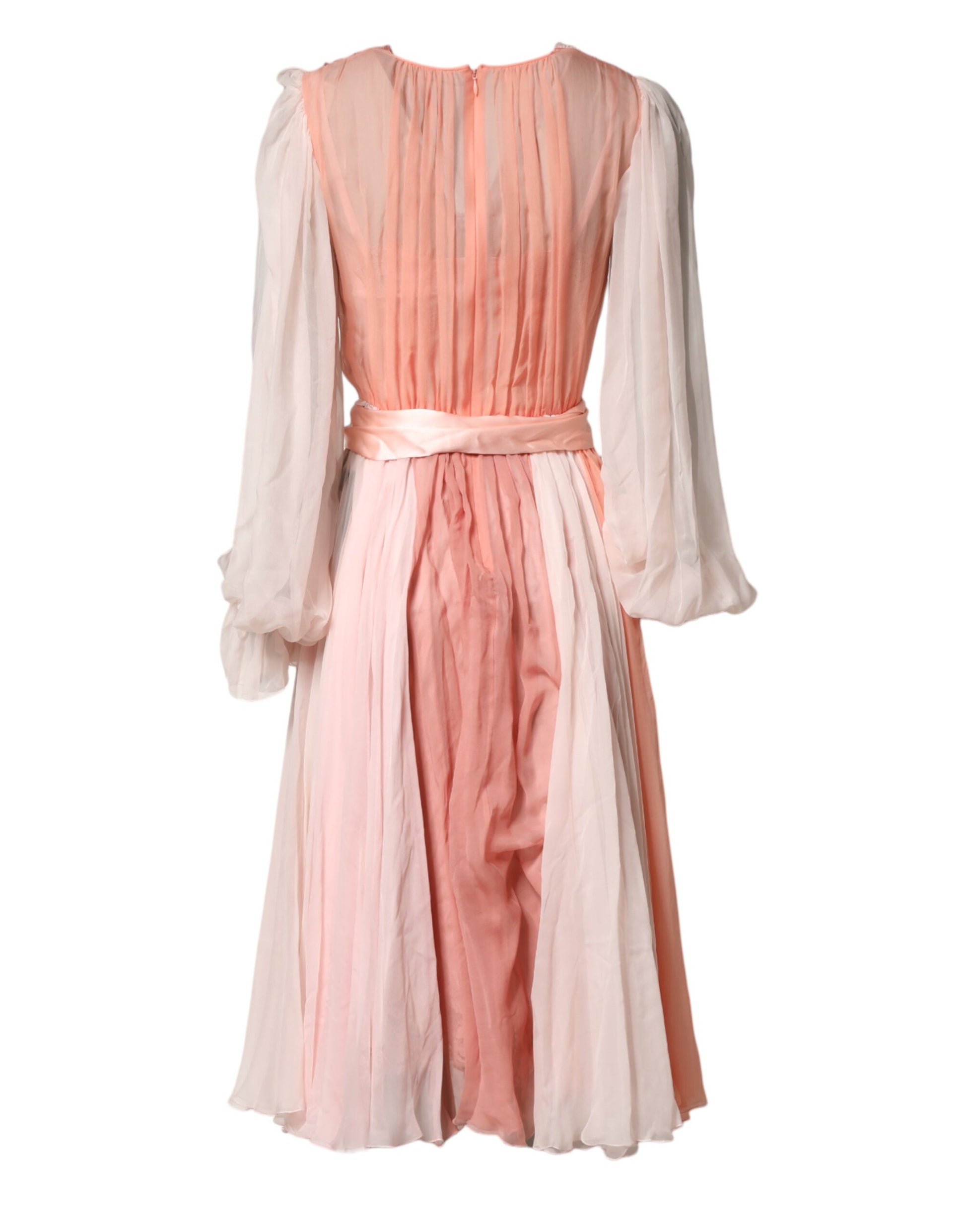 A long sleeve pink silk tulle dress with a V-neck