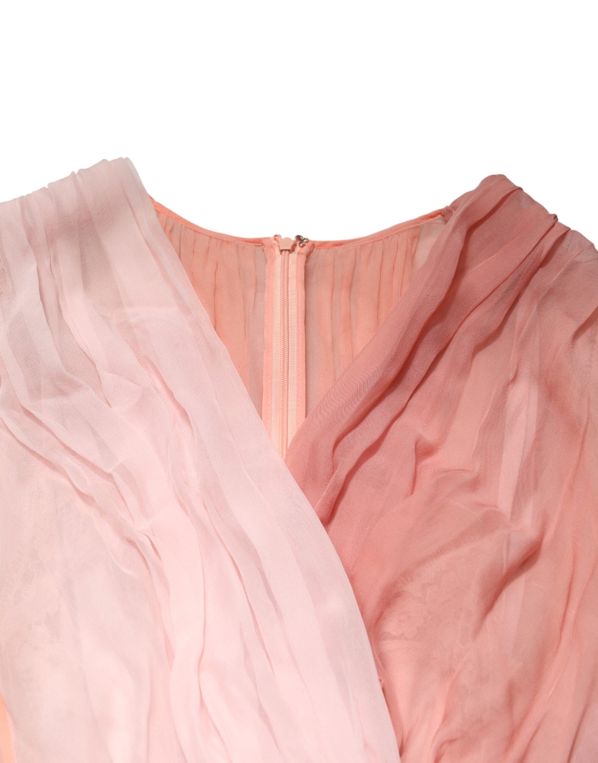 A pink silk tulle dress with long sleeves and a V-neck