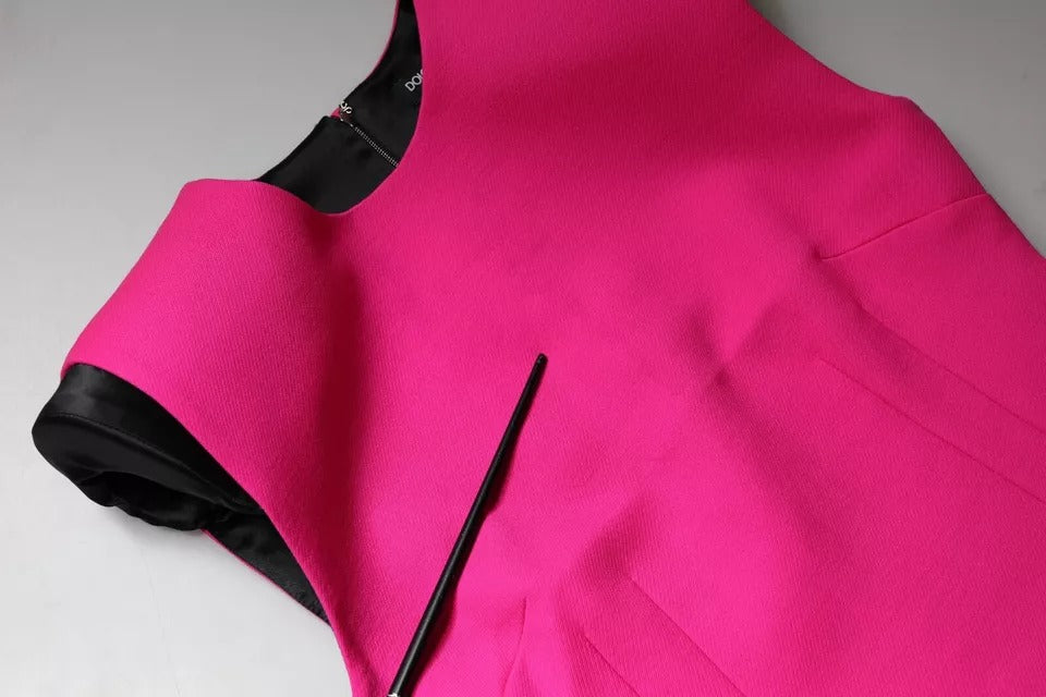 Pink sleeveless bodycon dress with black zipper detail