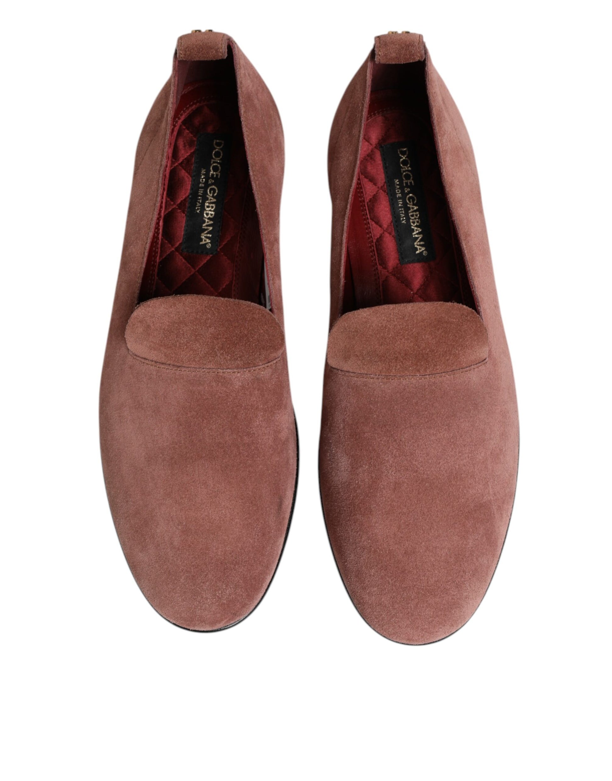 A pair of men's formal dress shoes in pink suede with a red lining