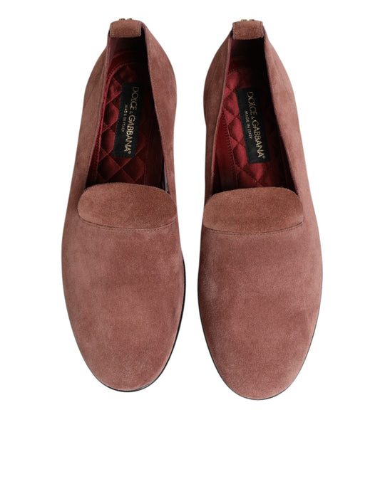 A pair of men's formal dress shoes in pink suede with a red lining
