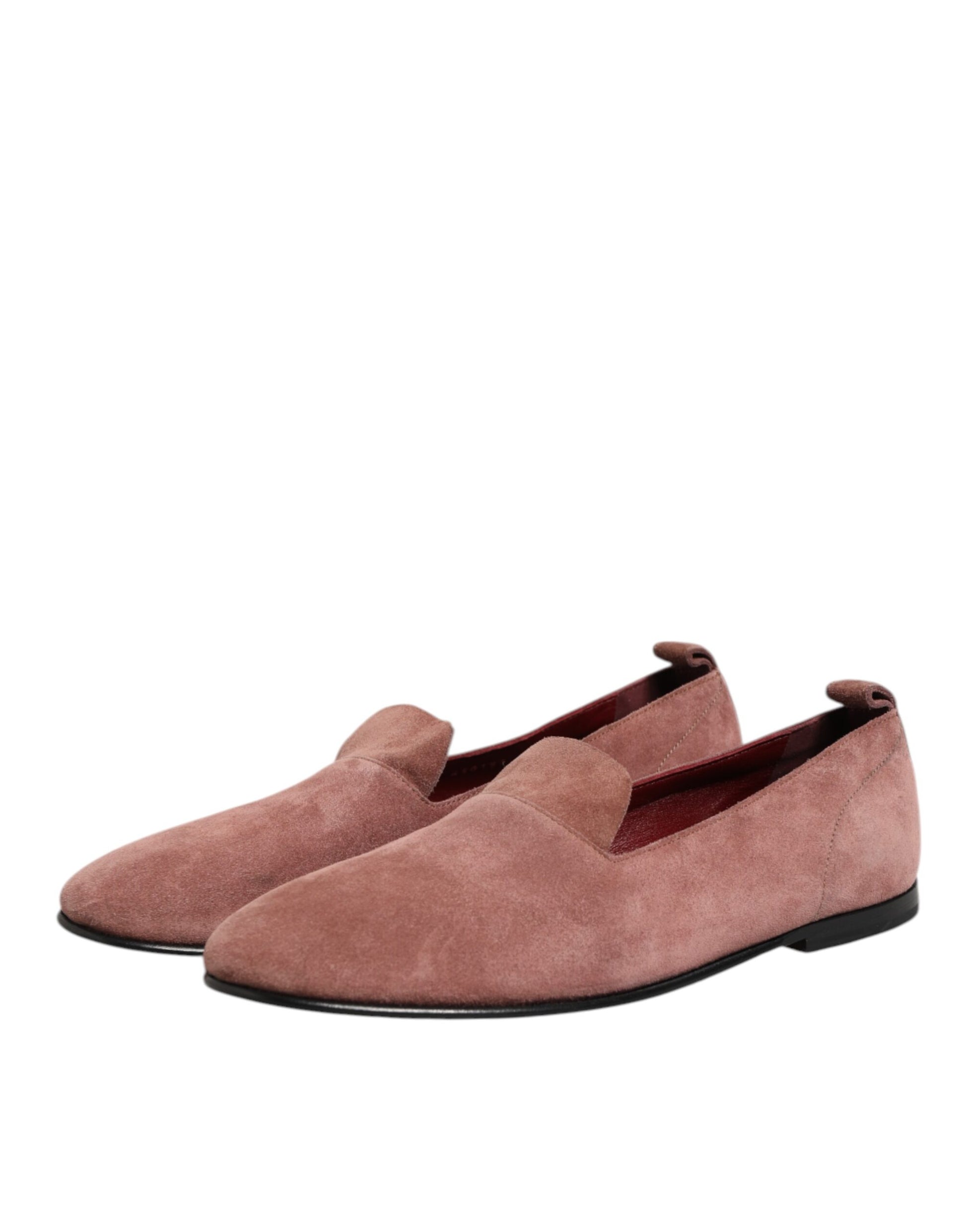 Pair of pink suede loafers with black soles, formal men's dress shoes