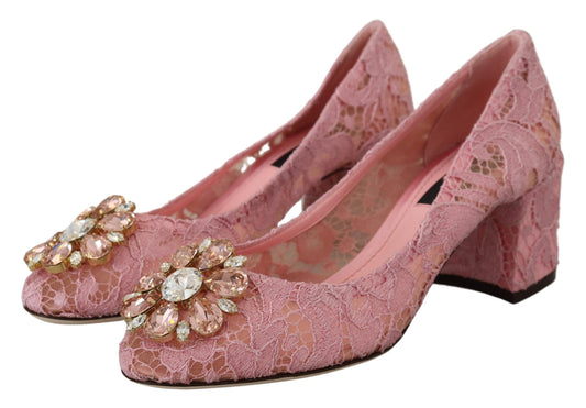 Pair of pink high heel shoes with rhinestones and lace detailing