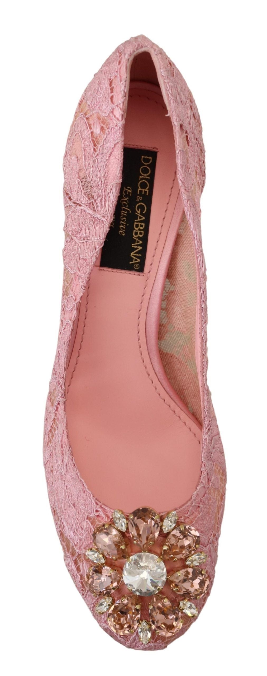Pink shoe with embellishments and a bow on top