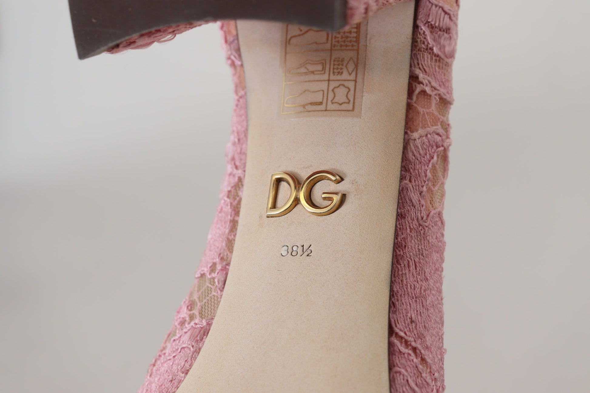 Pink shoe with gold DG logo on insole