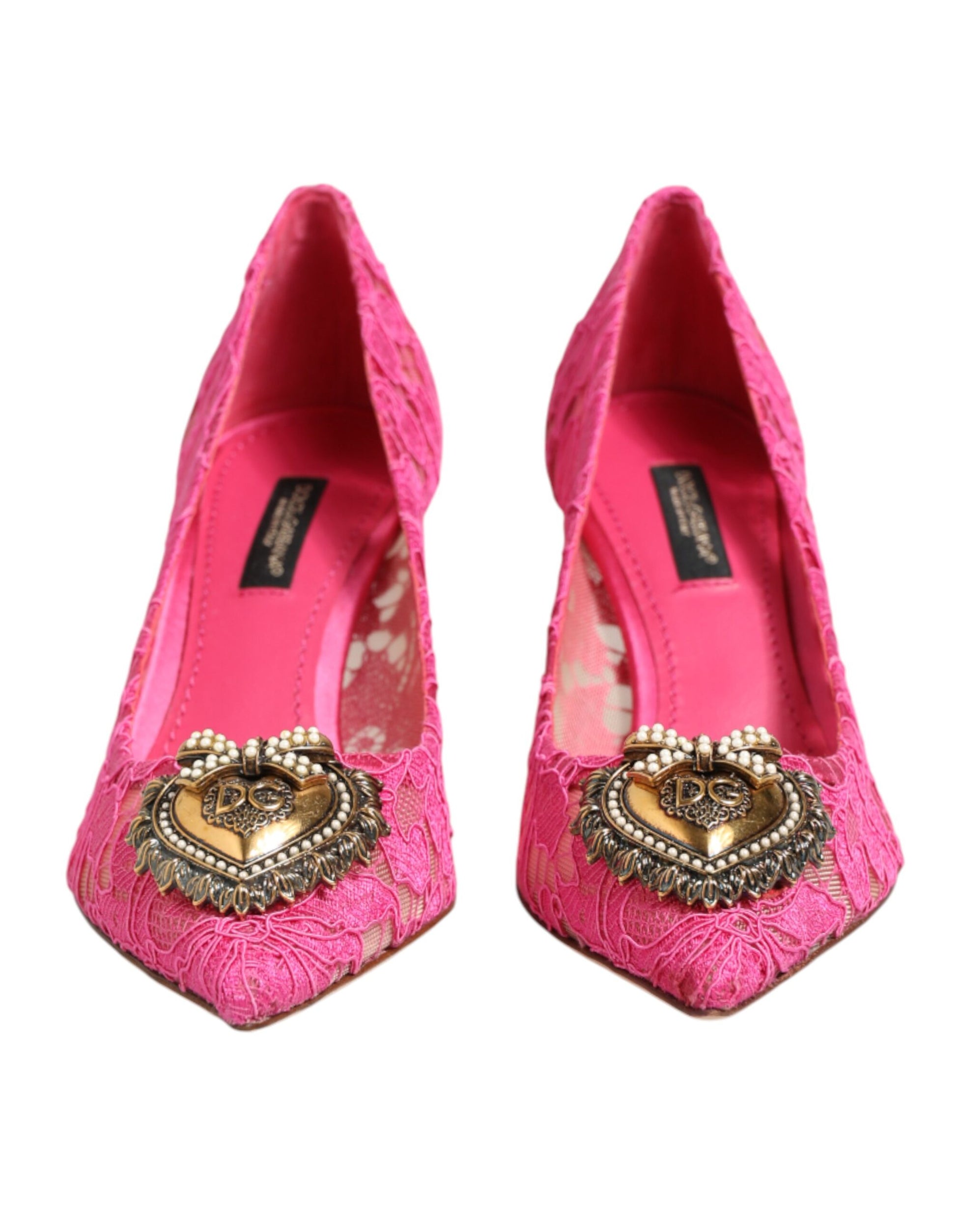 Pair of pink high heel shoes with embellishments on top