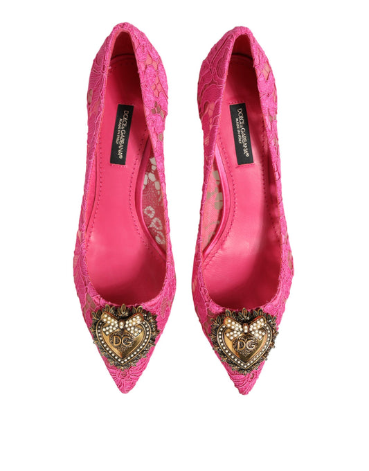 Pair of pink high heel shoes with heart embellishments on toes