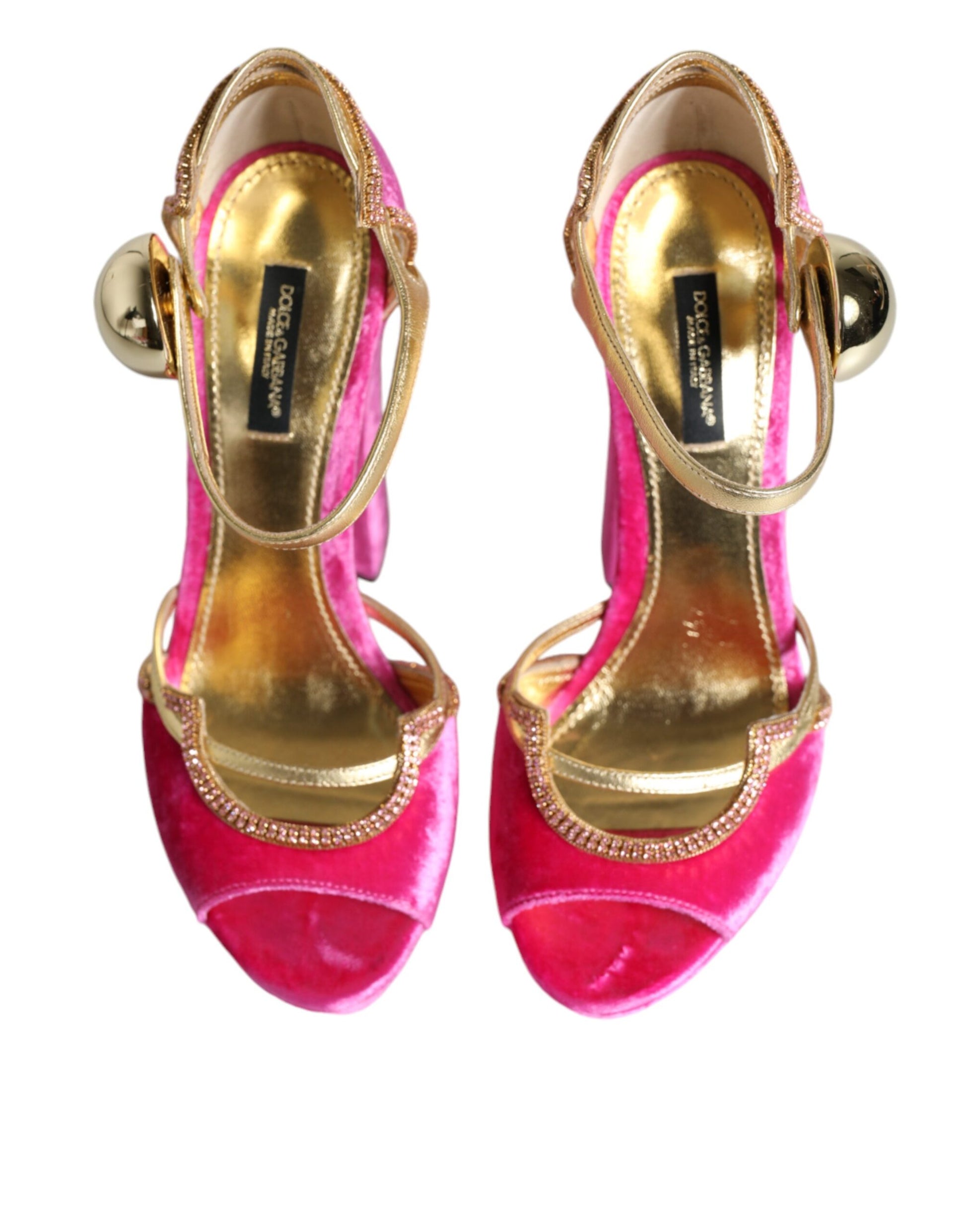 Pair of gold and pink high heel shoes