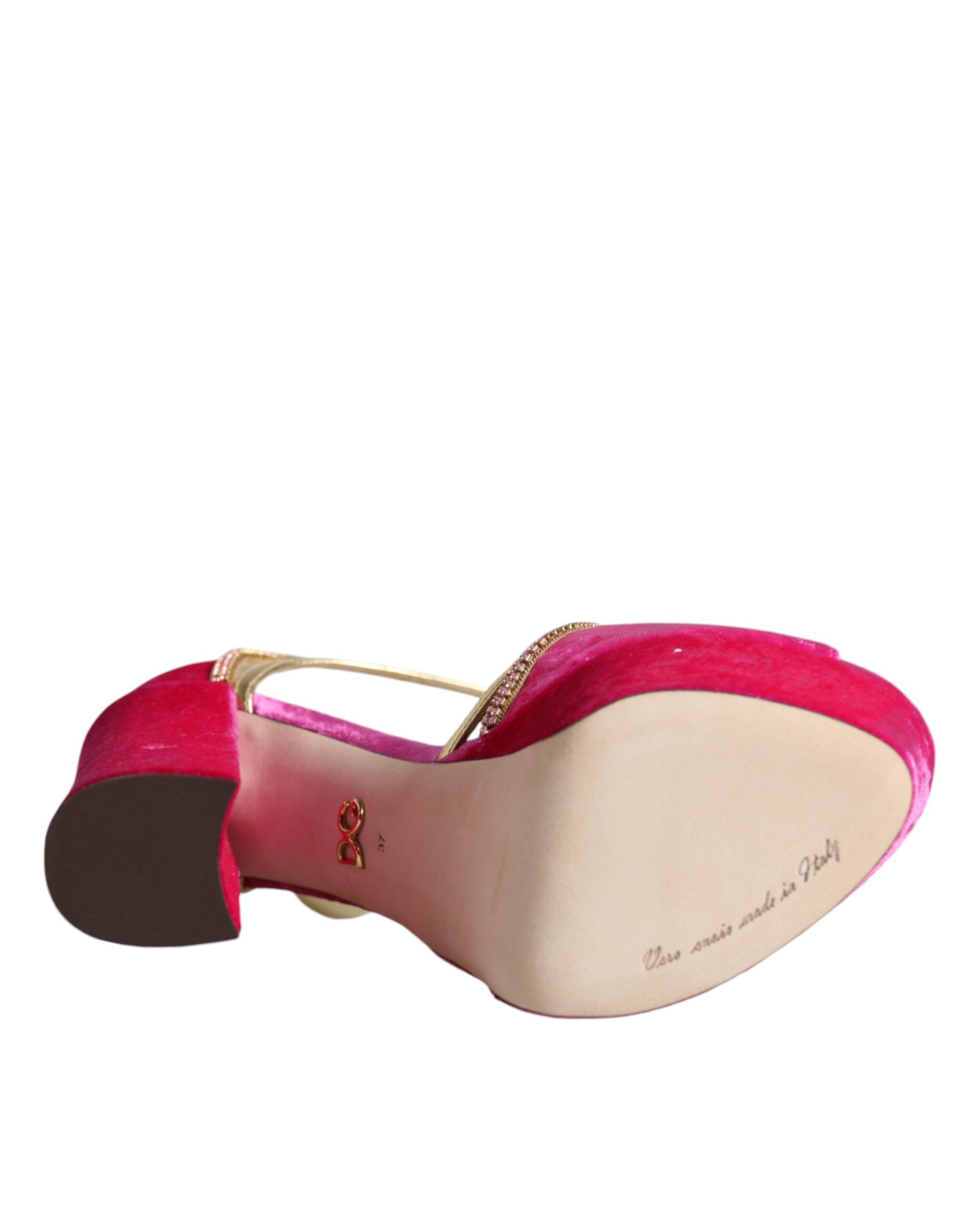 Pink high heel shoe with gold accents