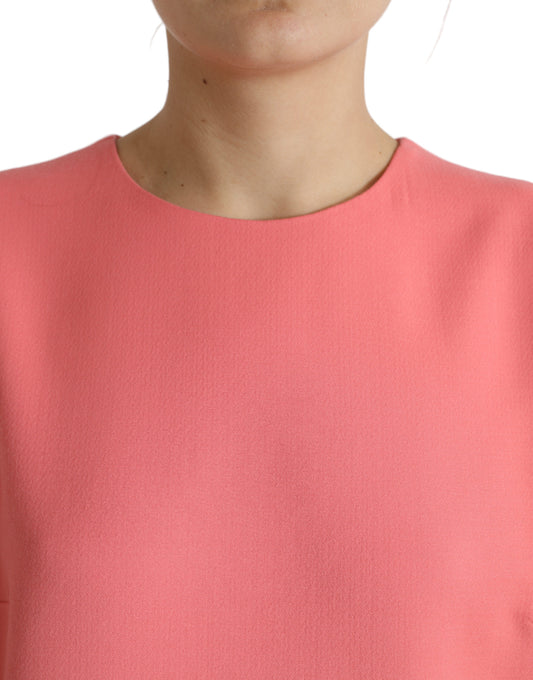 A sleeveless pink dress with a textured fabric