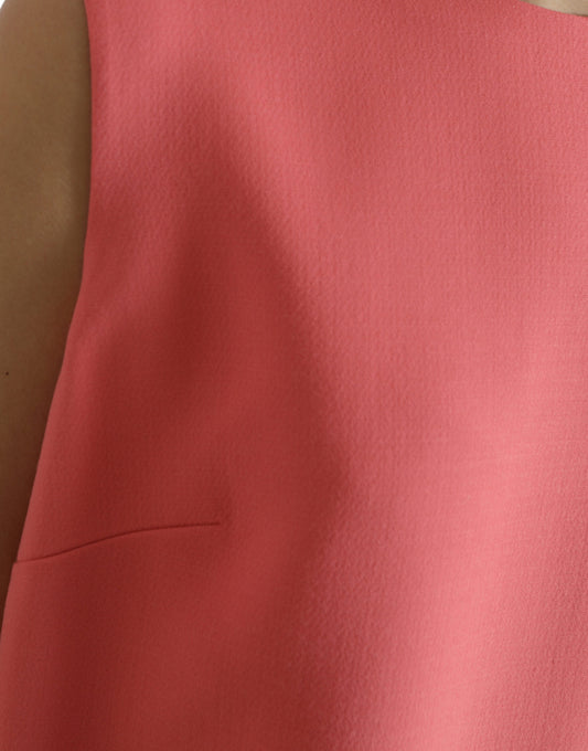 A sleeveless pink dress with a textured fabric