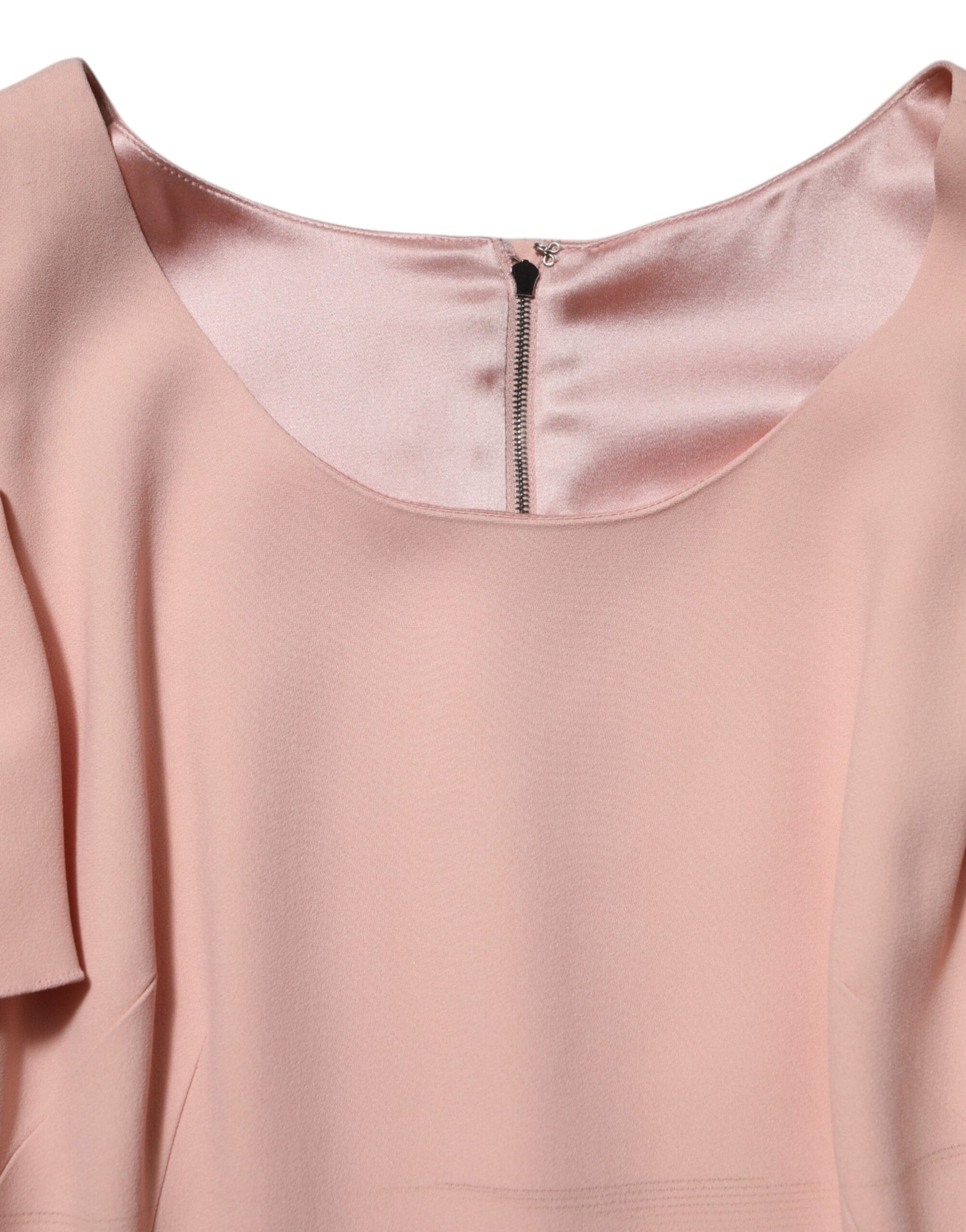 A pink midi dress with a fit and flare silhouette, made of viscose fabric