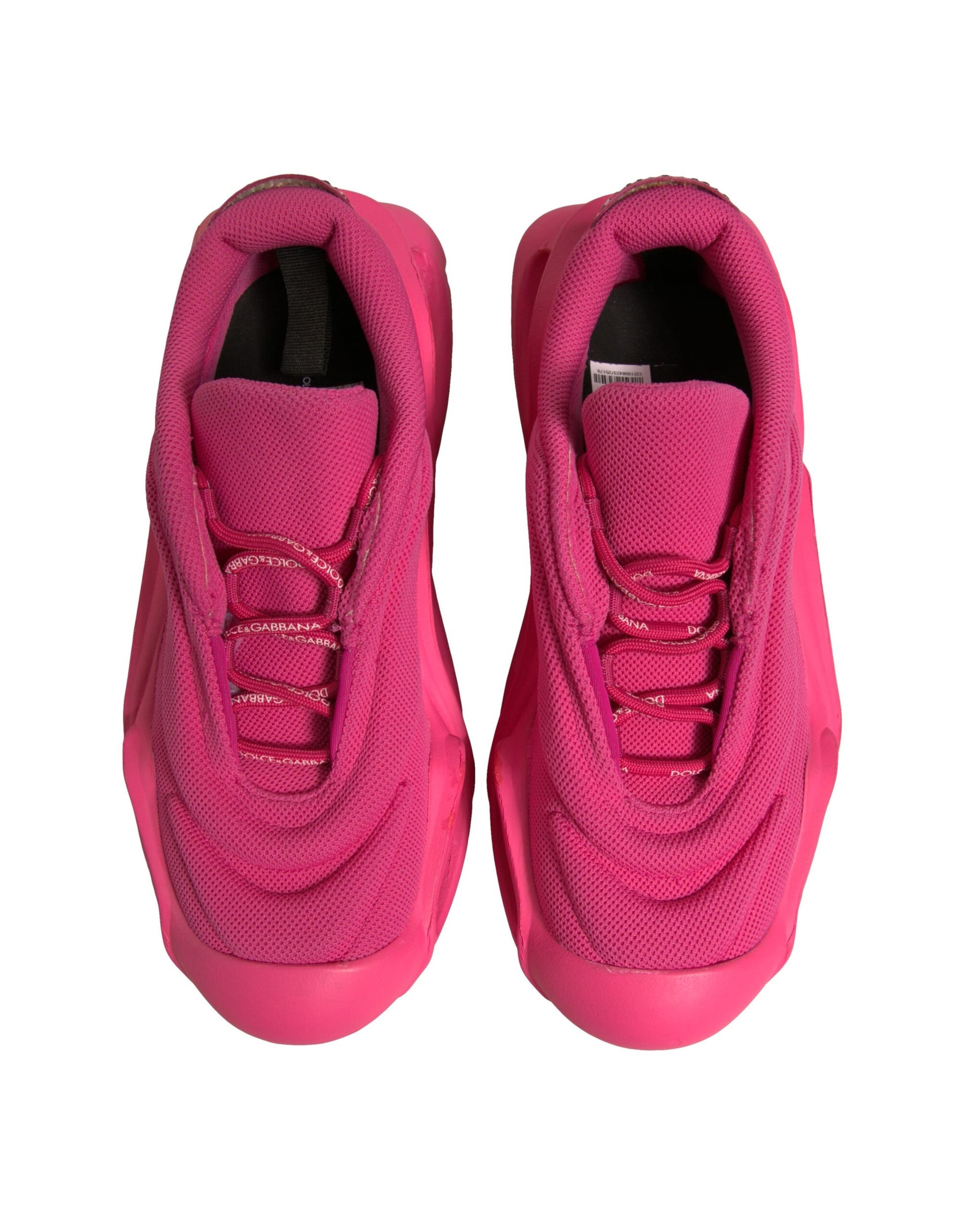 Pair of pink sneakers with laces