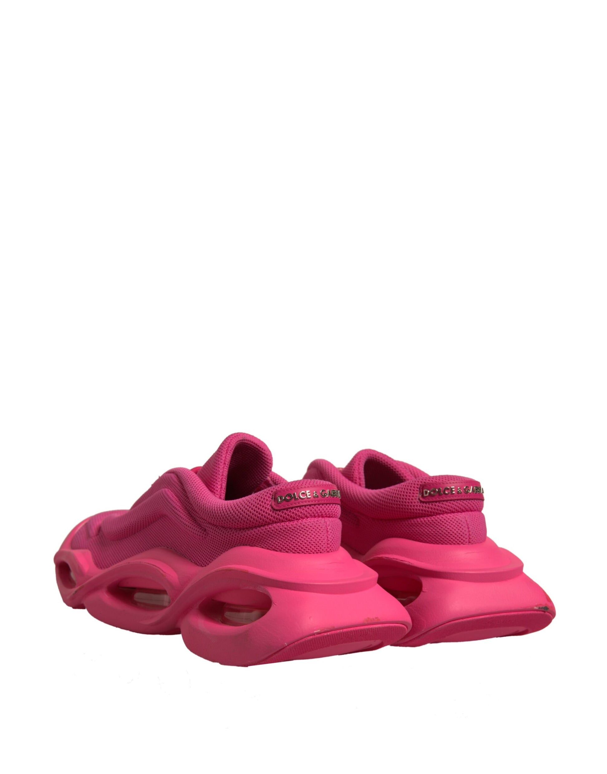 Pair of pink sneakers with white soles