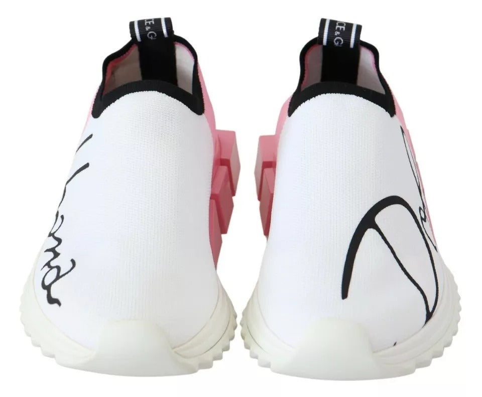 Pair of white and pink sneakers with black laces